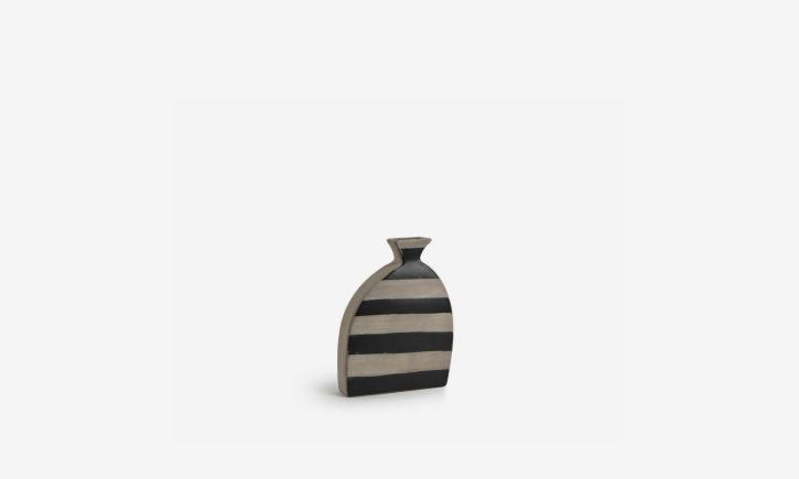 Leaning ceramic vase in bold black and natural stripe with natural stoneware-effect finish