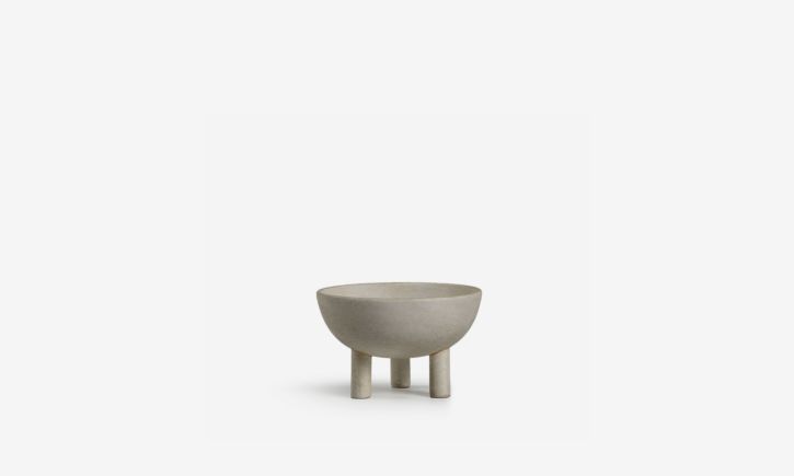 A natural scandinavian-inspired three-legged bowl, perfect for decorative or functional piece.