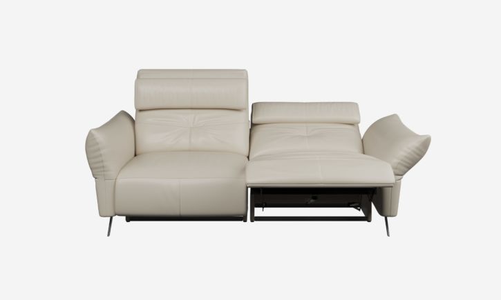 A cream-colored reclining modern leather sofa with plush armrests front view