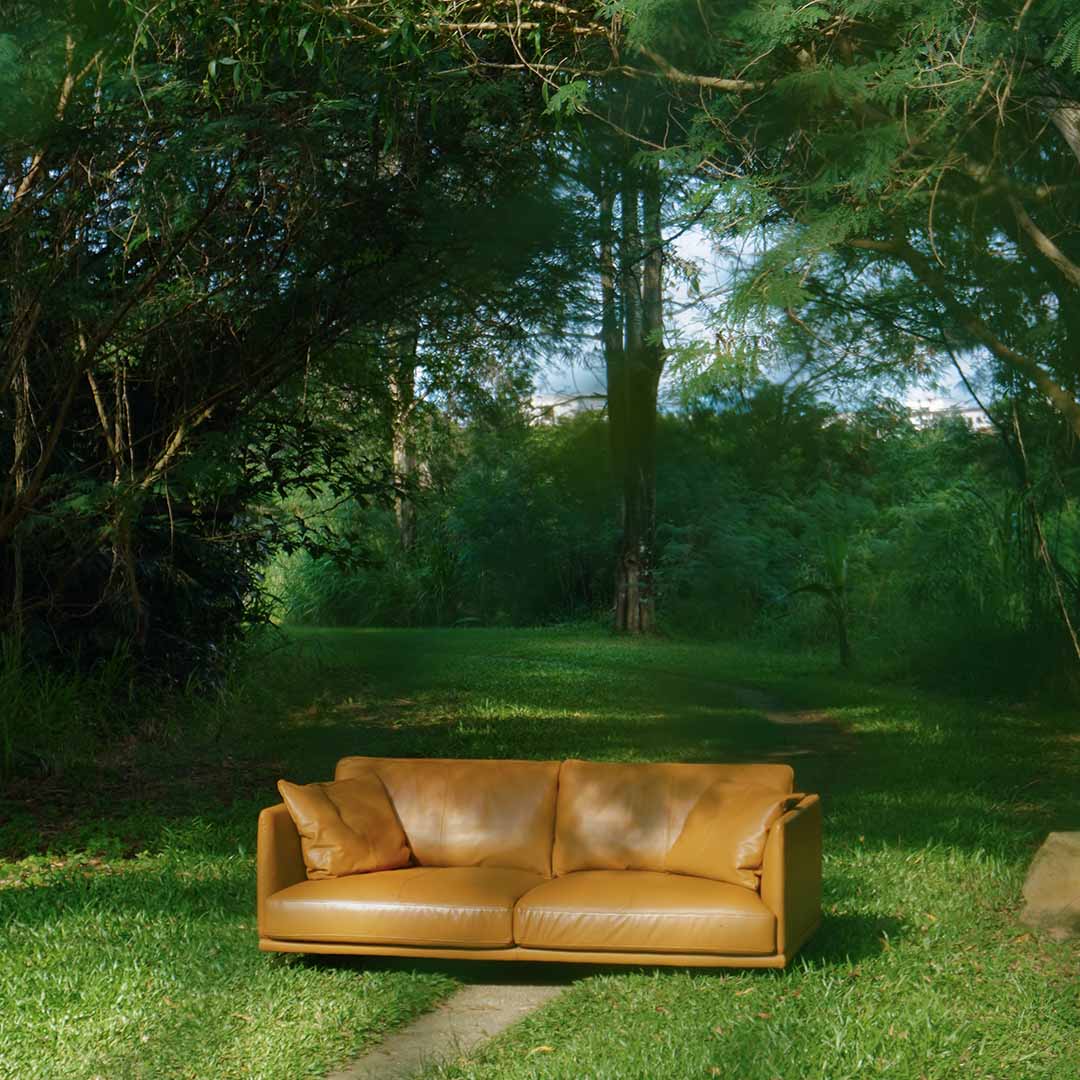 Lifestyle photo of Portage 3 Seater Sofa in Vedura Tan Leather in forest